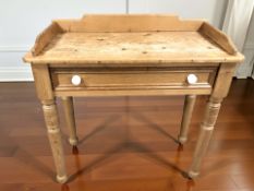 An early 20th century pine single drawer side table, width 92 cm.