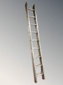 An aluminium extension ladder.