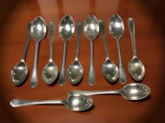 Eleven silver golfing themed teaspoons, Sheffield marks.