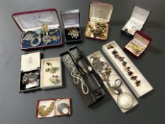 A collection of costume jewellery, silver charm bracelet, silver and marcasite items, watches,