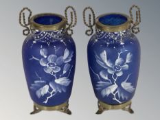 A pair of Victorian hand-painted blue glass and brass mounted twin-handled vases, height 17 cm.