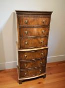 A reproduction mahogany bow front six drawer chest, 55 cm x 42 cm x 131 cm.