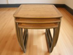 A Nathan nest of three teak tables, width 52 cm.