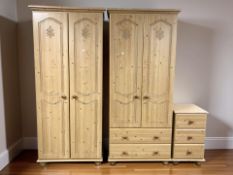 Two modern pine effect double door wardrobes and matching three drawer bedside stand.