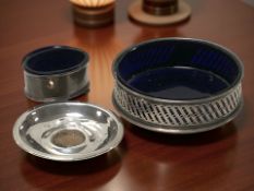 A silver dish with inset half penny,