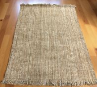 A brand new Lagos Gold 100 % jute rug, 230 cm x 160 cm.