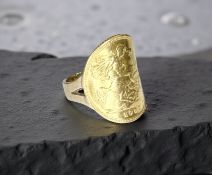 A 9ct gold ring set with a 1982 half sovereign, size K. CONDITION REPORT: 5.