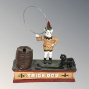 A reproduction cast metal money box surmounted by a clown, height 23 cm.