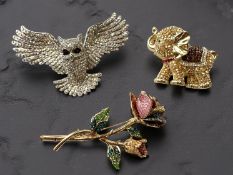 Three Butler & Wilson brooches, comprising an owl, elephant, and a rose, longest 7.