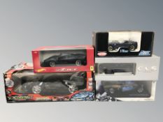 A group of boxed scale model die cast cars including Kyosho, Hot Wheels, etc.