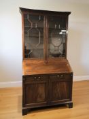 A George III style mahogany bureau bookcase, 119 cm x 64 cm x 234 cm.
