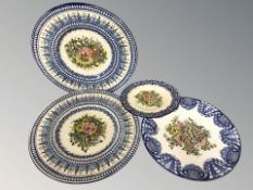 A group of continental pottery chargers and plates, largest 35 cm diameter.