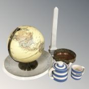 A globe, two pieces of Cornish Ware, a brass and copper dish,