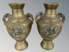 A pair of Chinese bronze twin handled vases, height 26 cm.