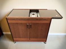 A hostess trolley, width 75 cm.