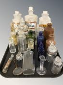 A group of antique glass chemist's bottles, stoneware bottles, etc.