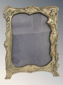 A brass Art Nouveau easel picture frame, height 30 cm.