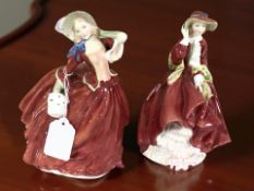 Two Royal Doulton figures 'Autumn Breezes' HN1934 and 'Top O' The Hill' HN1834.