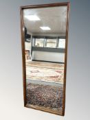 An early 20th century beech mirror, 56 cm x 129 cm.