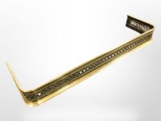 A Victorian pierced brass fire curb, width 105 cm.