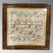 A Victorian alphabet sampler, signed J S and dated December 1877, 30 cm x 30 cm.