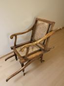 A beech and cane seated invalid's chair, labelled 'Carter, Invalid Chair Maker,