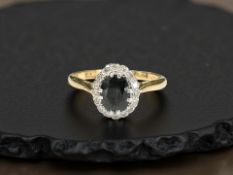 An 18ct yellow gold sapphire and diamond ring, size M. CONDITION REPORT: Weight: 2.