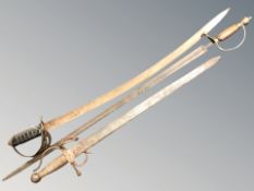 A replica Indian sabre, a Spanish sword and a further brass hilted sword.