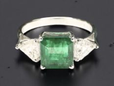 A good quality emerald and diamond ring in 18ct white gold,