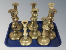 A group of Victorian brass candlesticks.