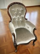 A Victorian carved mahogany salon armchair, width 72 cm.