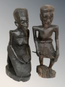 A pair of African carved hardwood figures, height 34 cm.
