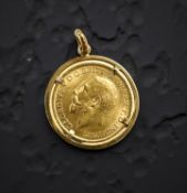 A George V full sovereign 1928, in 18ct gold pendant mount CONDITION REPORT: 10.