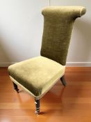 A Prie Dieu chair, in green dralon upholstery, height 90 cm.