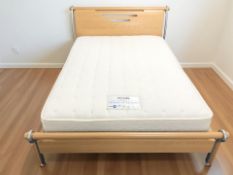 A contemporary 4 ft 6 bedframe with Myers mattress.