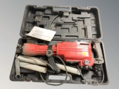 A demolition hammer in box.