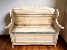 An early 20th century pine box settle, width 120 cm.
