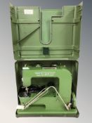 A vintage Elna Grasshopper electric sewing machine in case.
