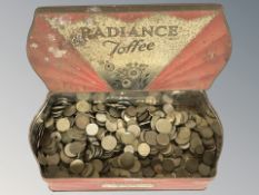 A Radiance toffee tin containing assorted foreign coins.