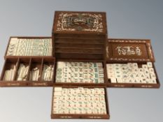 A mahjong set in bone inlaid hardwood box, and four tile boards.