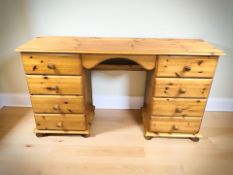 A modern pine dressing table, width 138 cm.