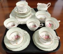 Twenty one pieces of Paragon tea china decorated with roses.