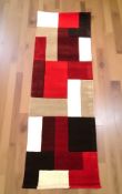 A brand new Lexus red ground 100% wool runner, 230 cm x 60 cm.