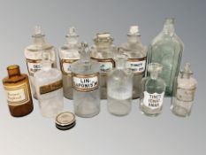A group of antique glass chemist's bottles.