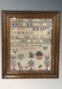A Victorian alphabet sampler worked by Margaret Annie Carter, 40 cm x 30 cm.