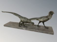 After Salvatore Melani : A patinated metal figure of two pheasants, 78 cm L x 26 cm H.