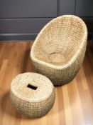 A wicker armchair and matching footstool, chair 79 cm wide.