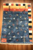 A 20th century woolen pictorial rug, 216 cm x 138 cm.