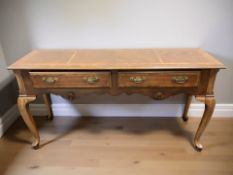 A reproduction yew wood console table, 134 cm x 43 cm x 68 cm.