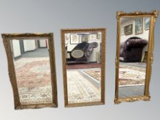 Three gilt framed mirrors, largest 48 cm x 108 cm.